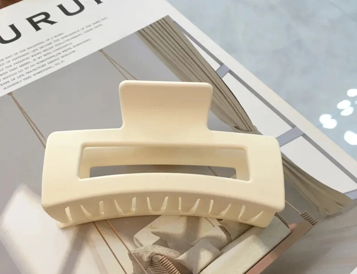 Beige hair clip on a magazine page