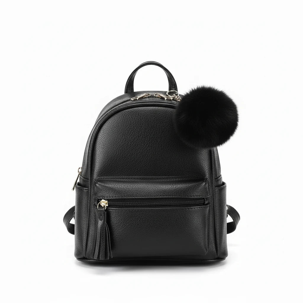 black back pack with pom-poms on a light background.