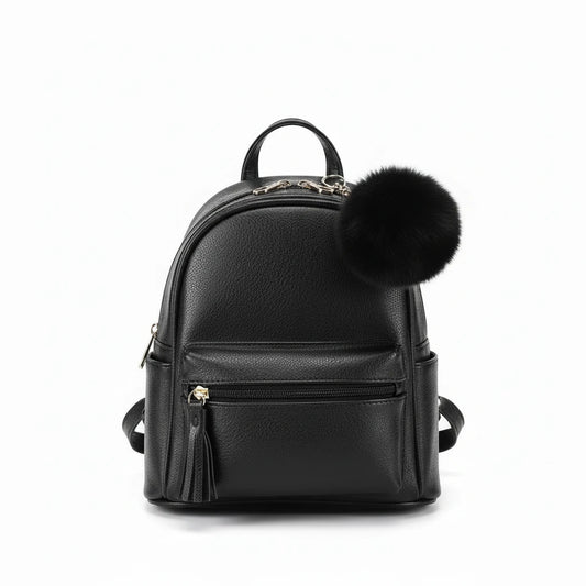 black back pack with pom-poms on a light background.